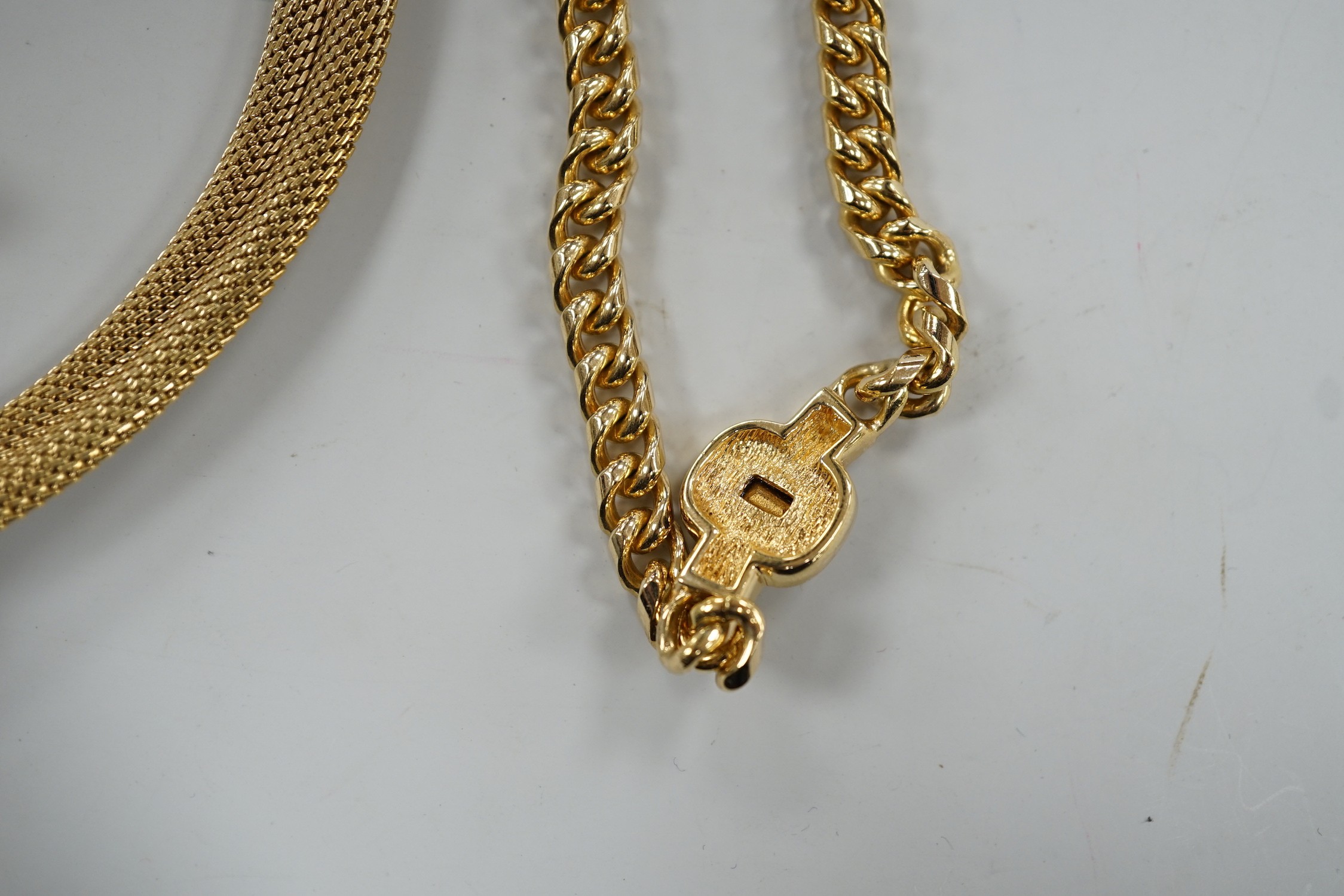A modern Christian Dior gilt metal and two colour paste set necklace, 37cm and a pair of matching ear clips and one other Christian Dior necklace.